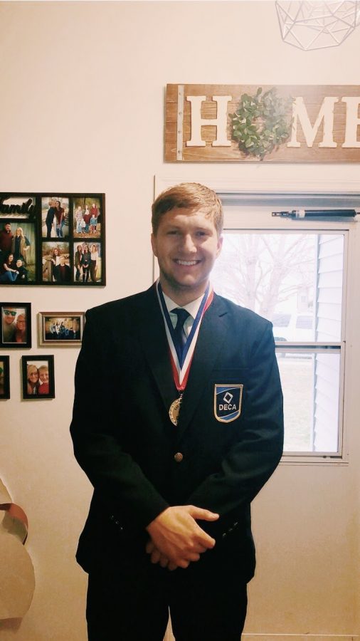 Tyler Began, his senior year, after getting First at the DECA competition, earning a trip to State.
