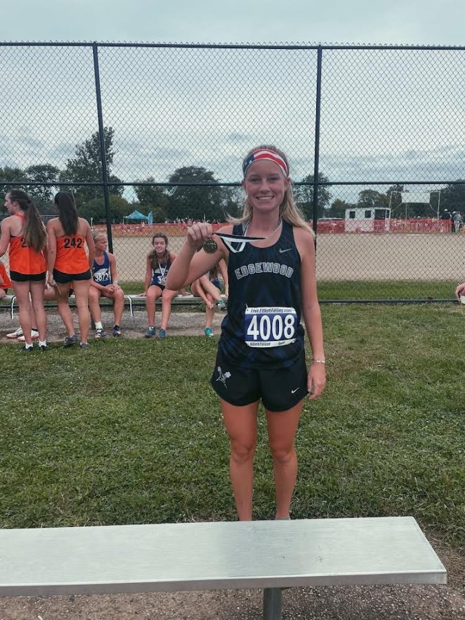 Photo taken by Coach Garver of Ashlynn as she placed 7th at the Neal Charske Invitational on September 25th, 2021. 