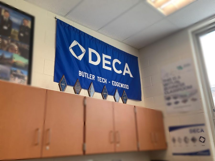 The+DECA+flag+and+trophies