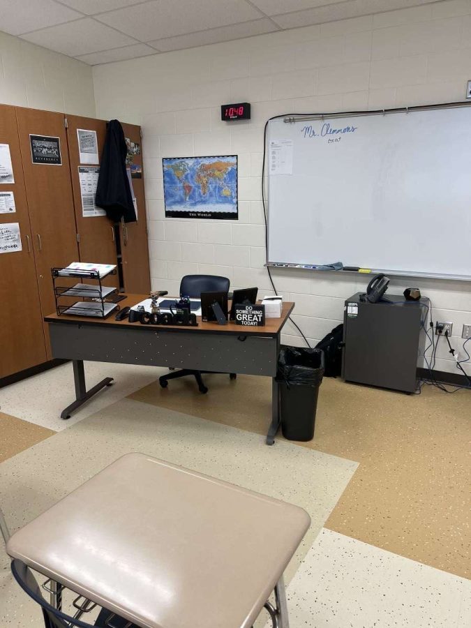 A teachers empty desk, missing a teacher or substitute teacher 