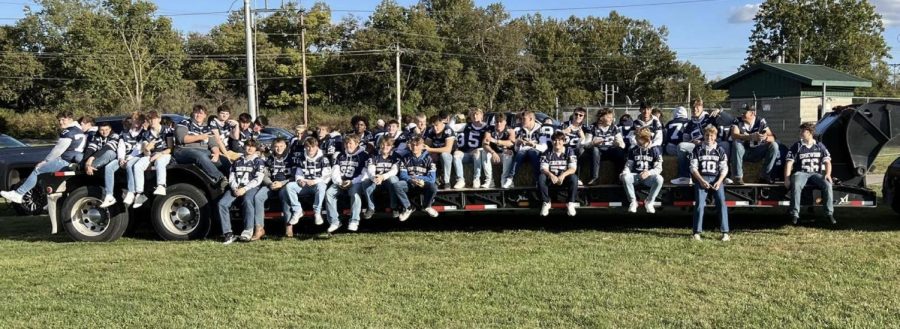 The football team rode in the parade on Thursday and then rolled over Northwest on Friday.    