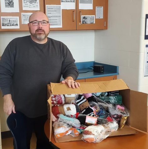 FCA advisor Gary Clemmons poses with the collected socks.  