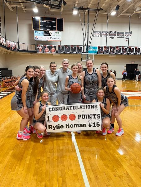Rylie celebrates with her team after breaking 1000 points.  Courtesy of Coach Fugate.  