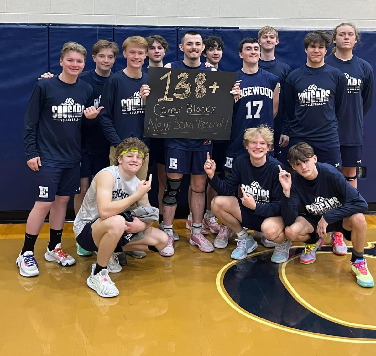 Senior Hayden Honchul poses with his team after breaking the school record. 