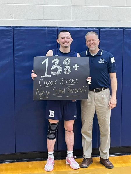 Senior, Hayden Honchul poses with Head Coach Mark Blair after breaking the school record.