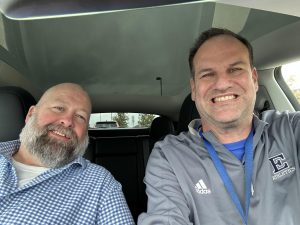 Mr. Geygan lets Mr. Harrison sit in the Tesla.  Photo courtesy of Mr. Geygan.  