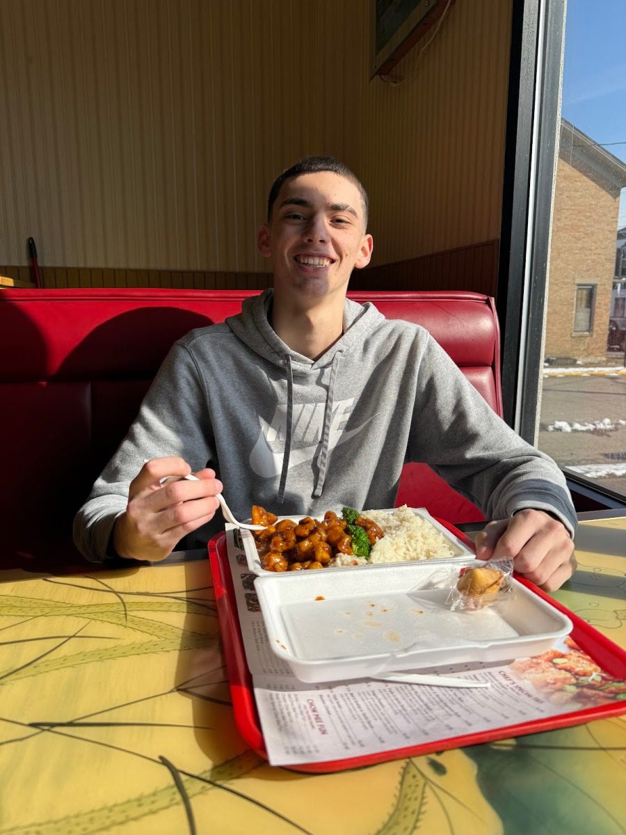 EHS junior Carson Downie enjoys a lunch special at Dragon China. 